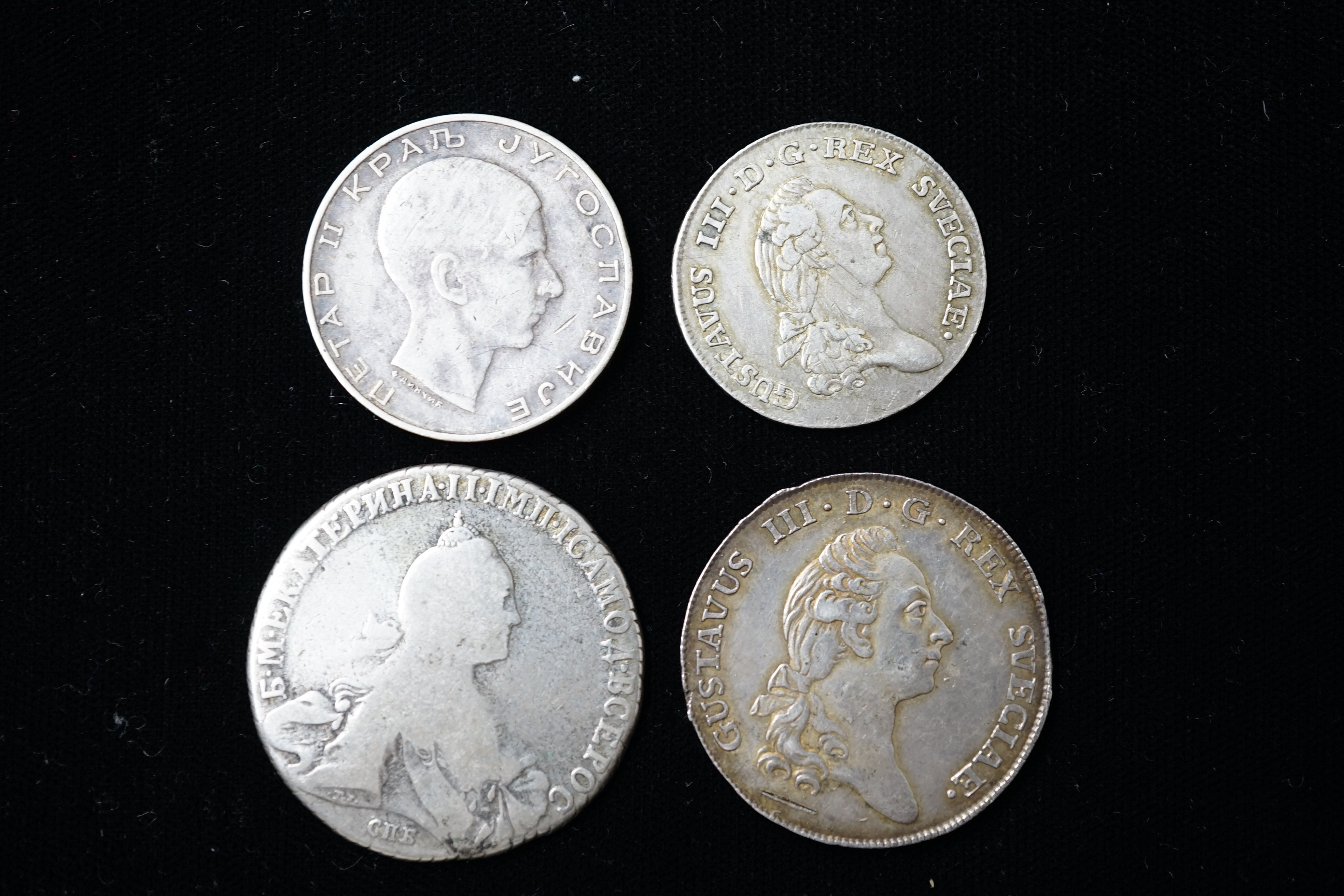 Sweden coins - 2/3 Riksdaler 1777, edge knocks otherwise VF, 1/3 Riksdaler 1784, as above, Russia Ekaterina (Catherine) II silver one rouble, 1770, worn and a Yugoslav 50 dinara 1938, VF (4)